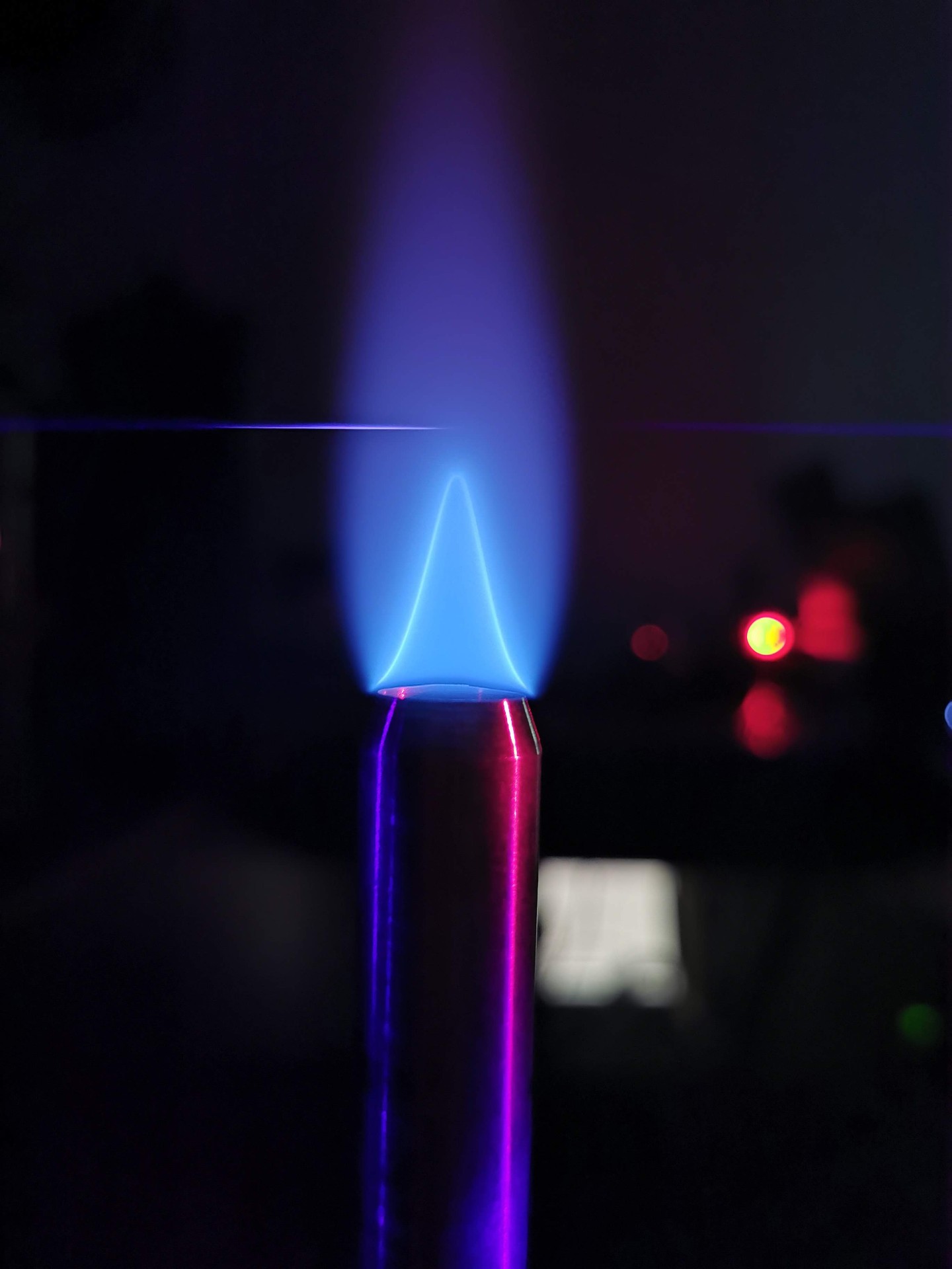 Blue flame with ultrafast laser beam passing through